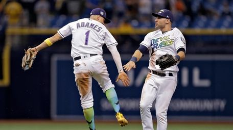 Tampa Bay Rays shortstop Willy Adames, left,