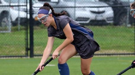Eastport-South Manor's Kylie Harrison controls the ball in
