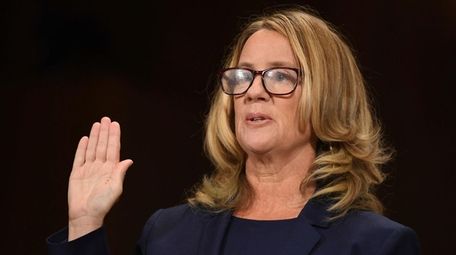 Christine Blasey Ford is sworn in to testify