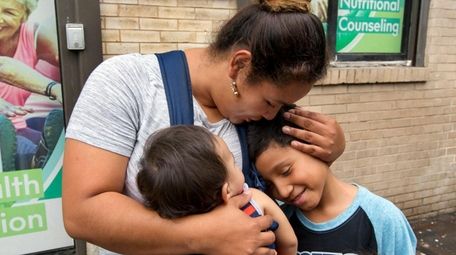 Honduran Eilyn Carbajal hugs her then-8-year-old son Nahun
