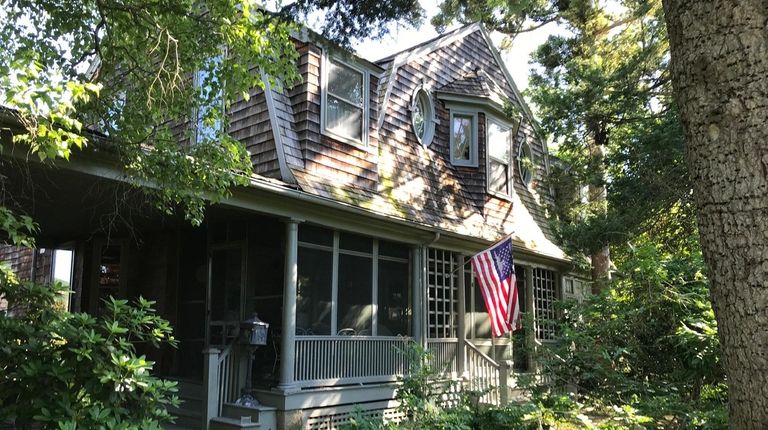 This Blue Point home has original moldings, porthole