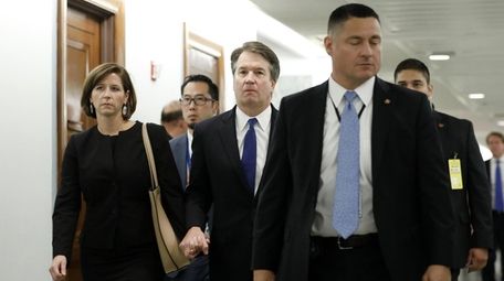 Brett Kavanaugh (center) and his wife, Ashley Kavanaugh,