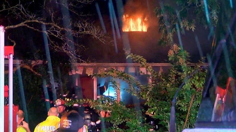 Firefighters at a house fire in Yaphank on