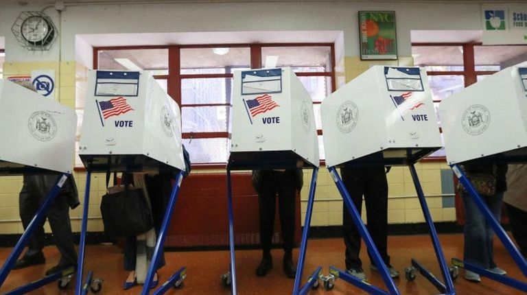 Voting booths are shown in this undated photo.