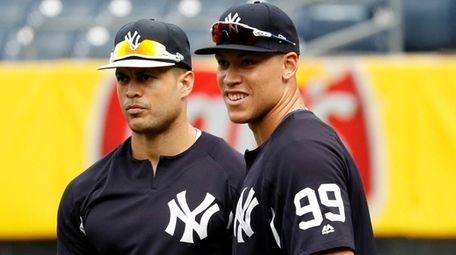 Yankees outfielders Giancarlo Stanton, left, and Aaron Judge