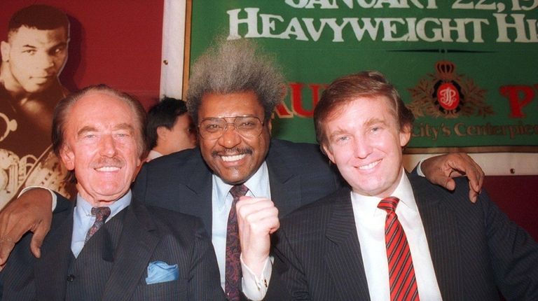 Donald Trump, right, with his father, Fred Trump,
