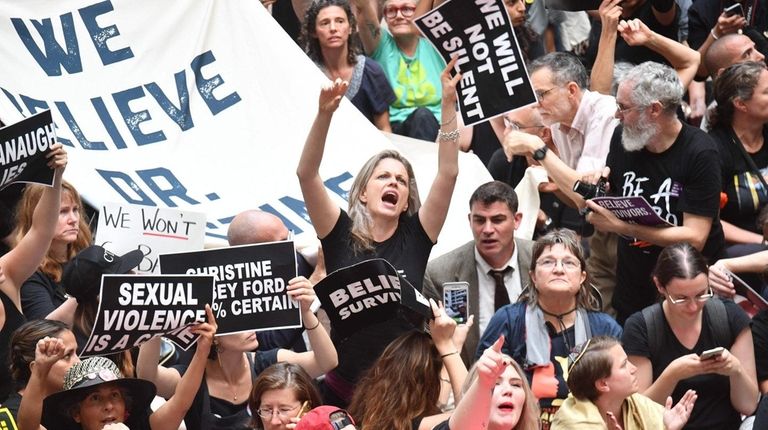 Demonstrators oppose the confirmation of nominee Brett Kavanaugh