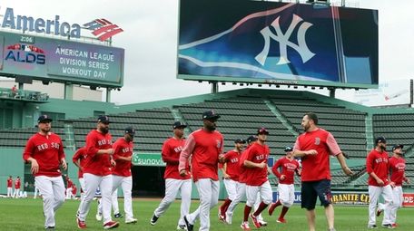 Boston Red Sox players warm up during a