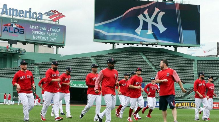 Boston Red Sox players warm up during a