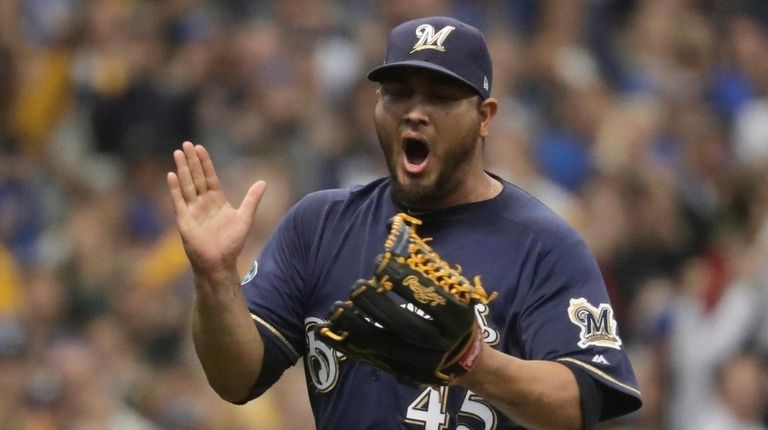 Milwaukee Brewers starting pitcher Jhoulys Chacin reacts after
