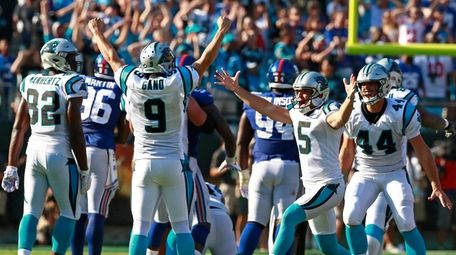 Panthers' Graham Gano (9) celebrates his game-winning, 63-yard