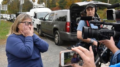 Barbara Douglas of Danamora, New York, reacts while