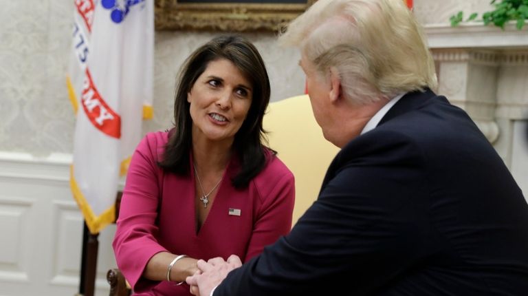 President Donald Trump meets with outgoing U.S. Ambassador