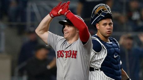 Brock Holt crosses home plate on his home