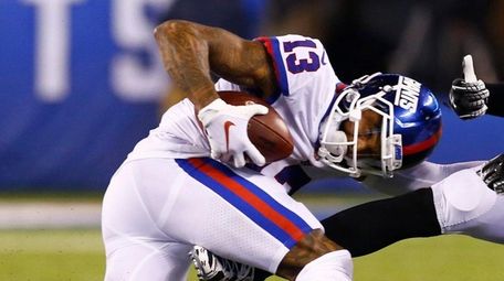 Odell Beckham Jr. of the Giants is tackled