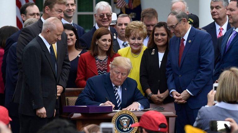 President Donald Trump signs the VA Mission Act