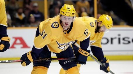 Nashville Predators left wing Austin Watson waits for