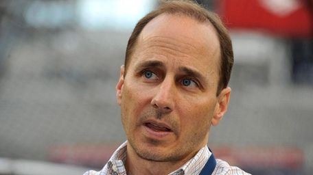 Yankees general manager Brian Cashman talks to reporters