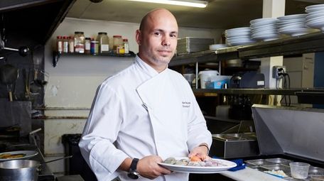 Chef Alex Bujoreanu, here in the kitchen of