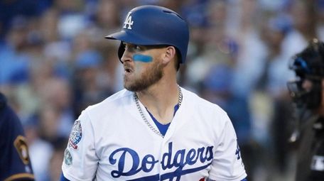 The Dodgers' Yasmani Grandal reacts after striking out