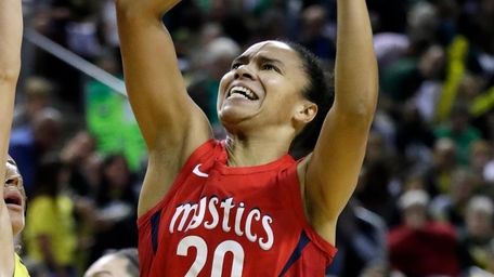 Washington Mystics' Kristi Toliver shoots over Seattle Storm's