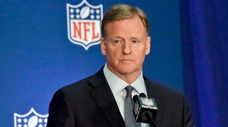 NFL commissioner Roger Goodell listens during a press