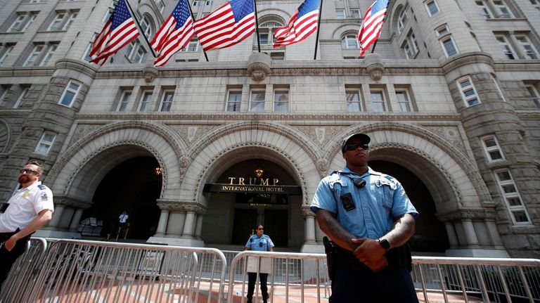Law enforcement officers stand guard in front of