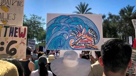 Protesters rally at a Keep Families Together march