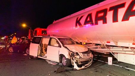 Several vehicles, including a minivan and an oil