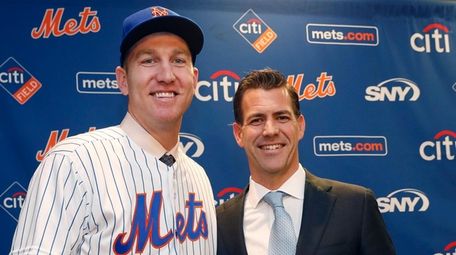 Todd Frazier, poses for photographers with his agent,