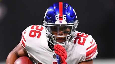 Giants running back Saquon Barkley runs the ball