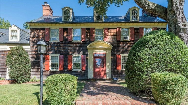The master bedroom in this Old Brookville Colonial