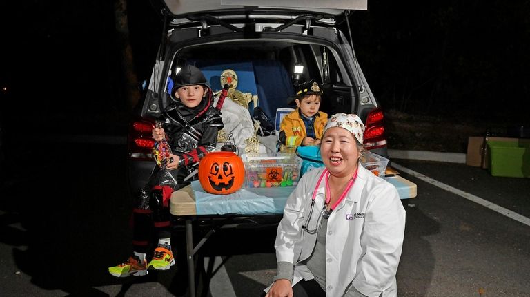 Alicia Lam and her sons Liam, left, and