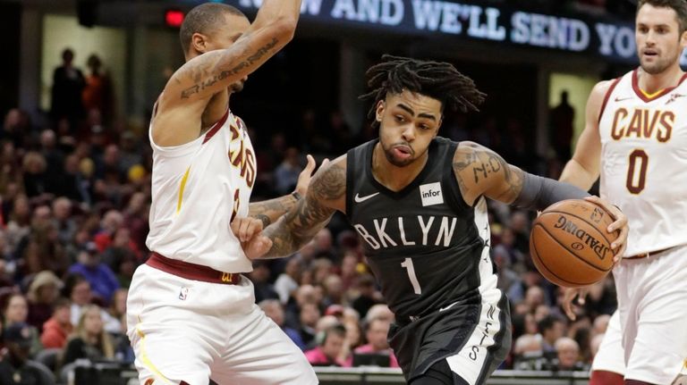 Nets' D'Angelo Russell (1) drives against Cleveland Cavaliers'