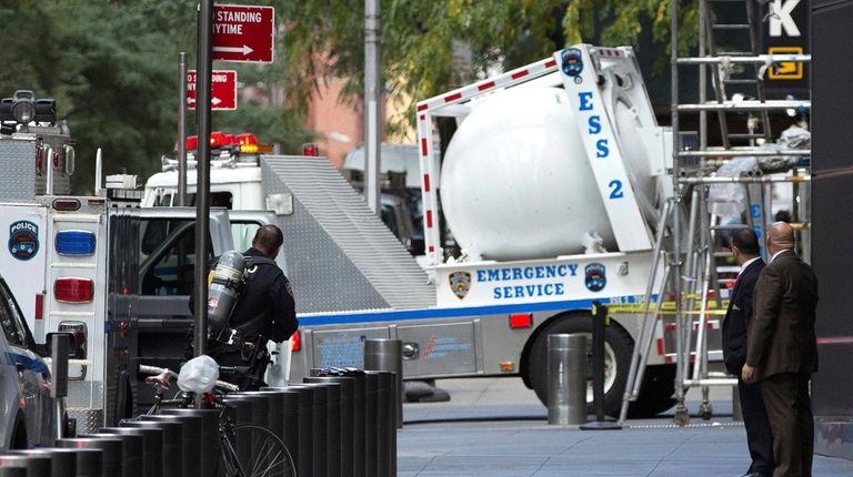 An NYPD bomb squad vehicle departs from outside