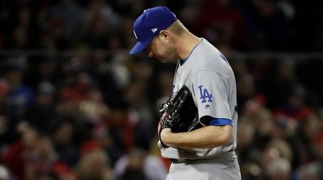 Los Angeles Dodgers pitcher Ryan Madson reacts after