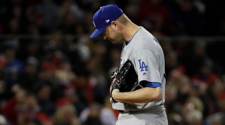 Los Angeles Dodgers pitcher Ryan Madson reacts after