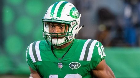 Jets running back Trenton Cannon runs the ball