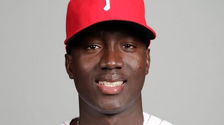 Then-Phillies pitcher Franklyn Kilomeposes for a photo during
