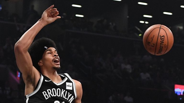 Nets center Jarrett Allen dunks against the New