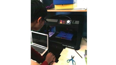 Kidsday reporter Kevin Chang works with a 3D