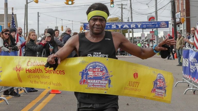 Boyd Carrington crosses the finish line as the