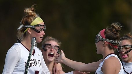 Grace Kelly #5 of Garden City, left, gets
