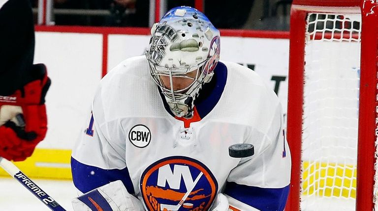 Islanders goaltender Thomas Greiss blocks a shot by