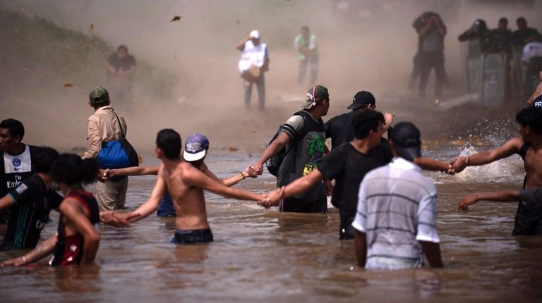Dust clouds are created by a Mexican police