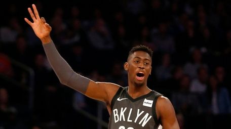 The Nets' Caris LeVert reacts after teammate D'Angelo