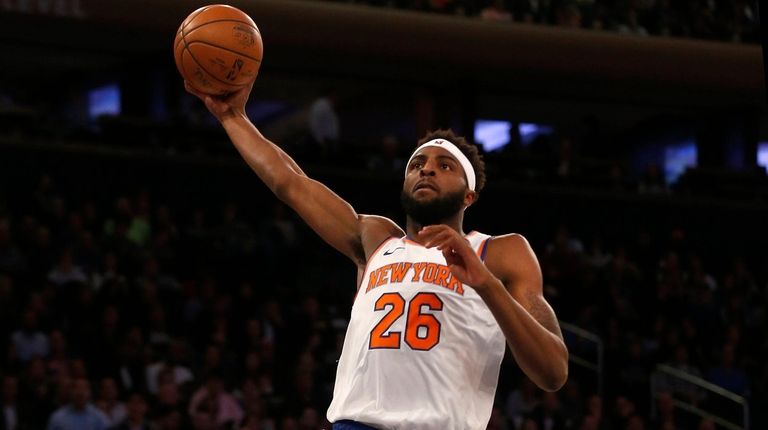 The Knicks' Mitchell Robinson goes in for the