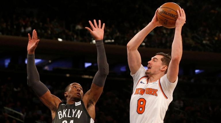The Knicks' Mario Hezonja attempts a shot in