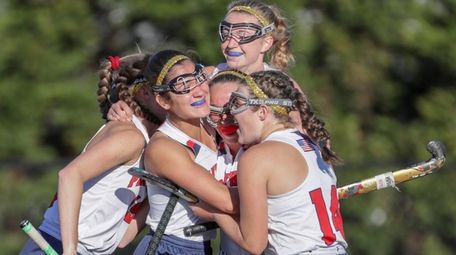 Jaedyn Scarlatos #20 of Miller Place is congratulated