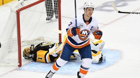 The Islanders' Anders Lee celebrates after Tom Kuhnhackl